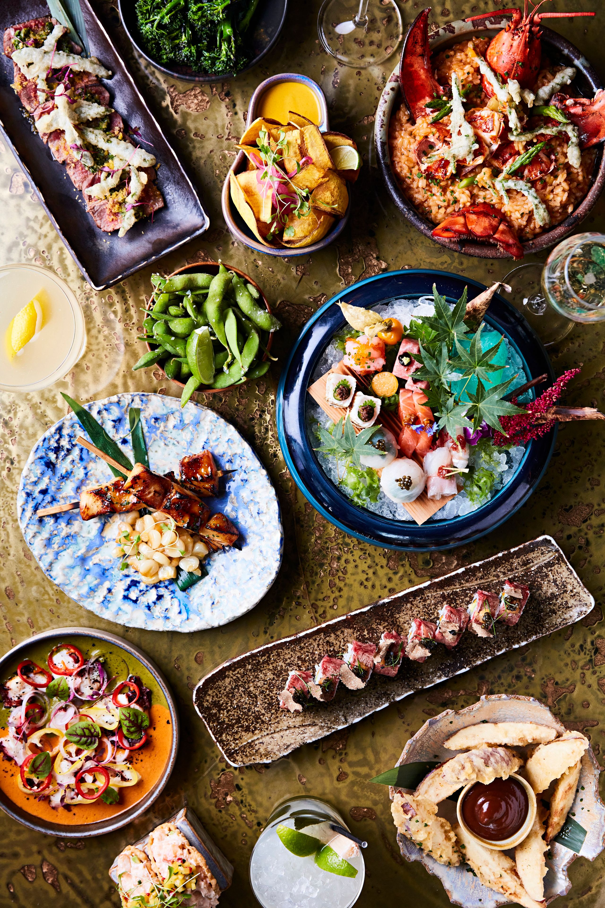 SUSHISAMBA Menus featuring a Japanese, Brazilian and Peruvian dishes artfully displayed on the table.