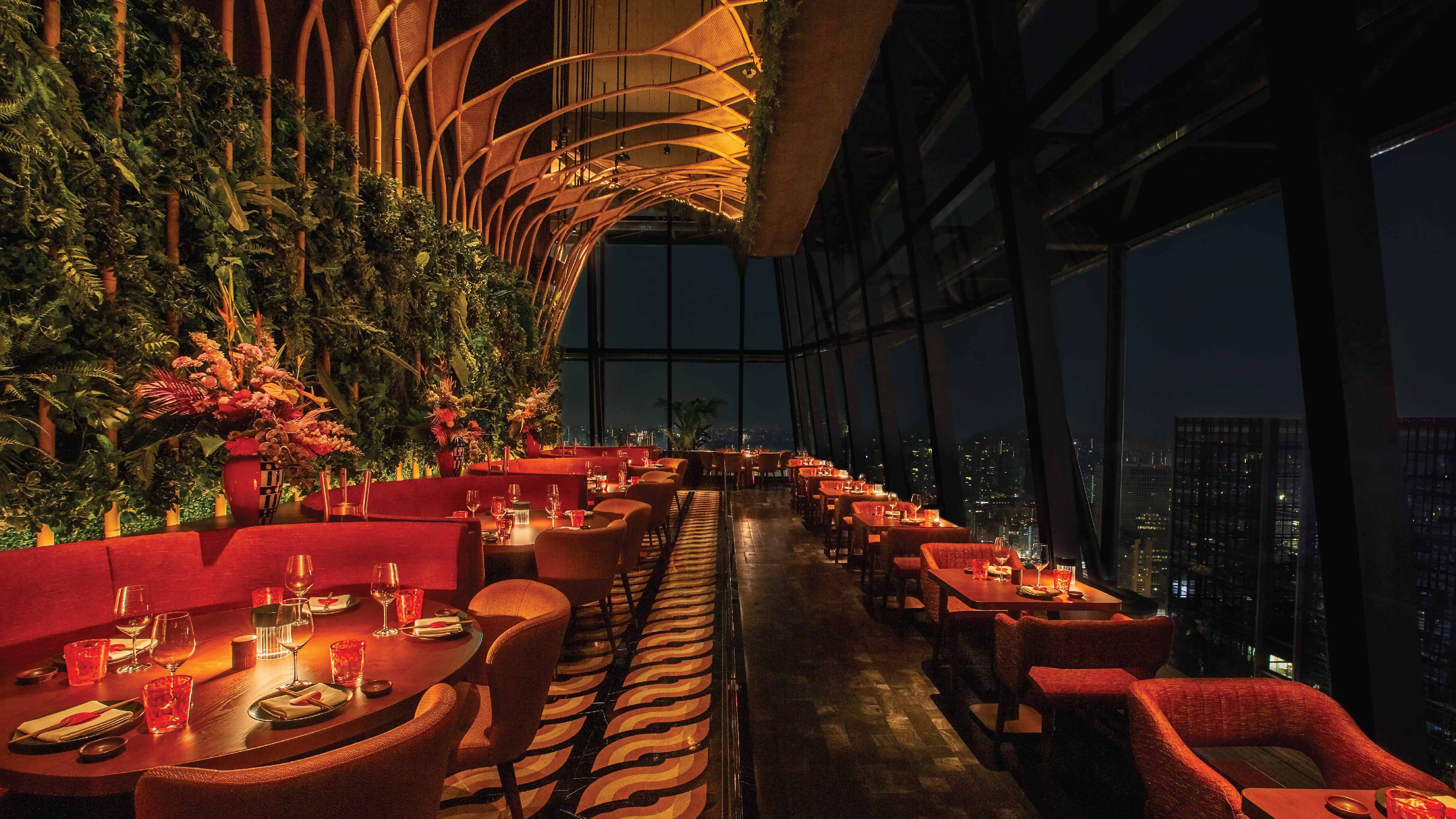 SUSHISAMBA SINGAPORE restaurant interior at night with red booths